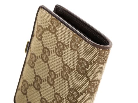 what kind of material does gucci wallet use|Gucci metal material.